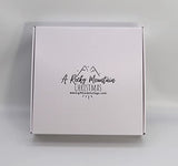 Gift Basket Village Rocky Mountain Christmas Gift Box: Gourmet Pretzels, Chocolate Covered Fruits & Nuts, Wafers, Pecan Roll, Cheese Spread, Roca