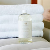 Hillhouse Naturals 32oz Fresh Linen laundry detergent. With scents of lemon and orange interwoven with bergamot, rose, jasmine and musk. Made in the