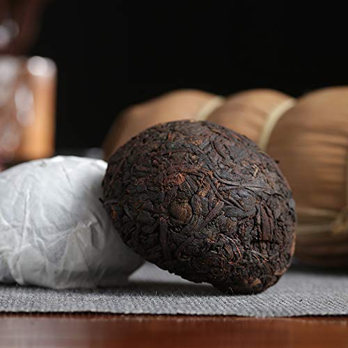 500g of ripe Pu 'er tea (5 pieces * 100g), 17.6oz tuocha wrapped in bamboo leaves