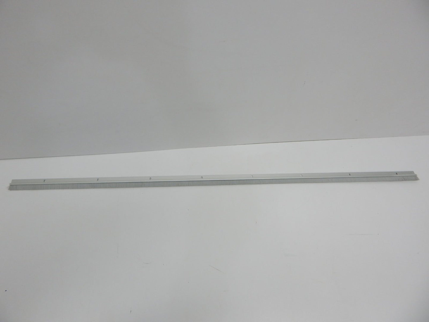Pemko Brush Door Bottom Sweep, Clear Anodized Aluminum with 0.625" Gray Nylon Brush insert, 0.25" Width, 1.375" H x 48" L - 18061CNB48