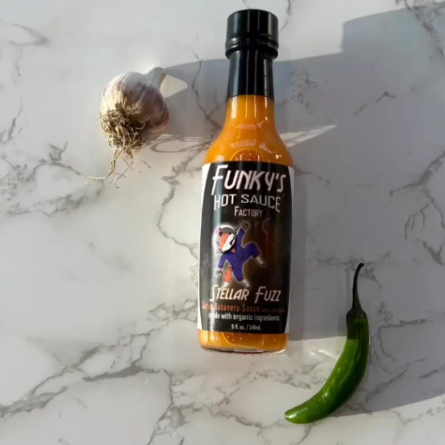 Heatonist Stellar Fuzz Hot Sauce by Funky's, Lingering Heat With Flavors Of Habanero, Savory Garlic & Ginger, Made With All Natural Ingredients, 5 fl