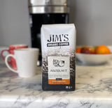 Jim’s Organic Coffee - Hazelnut, All Natural Flavored Blend - Light Roast, Ground Coffee, 12 oz Bag