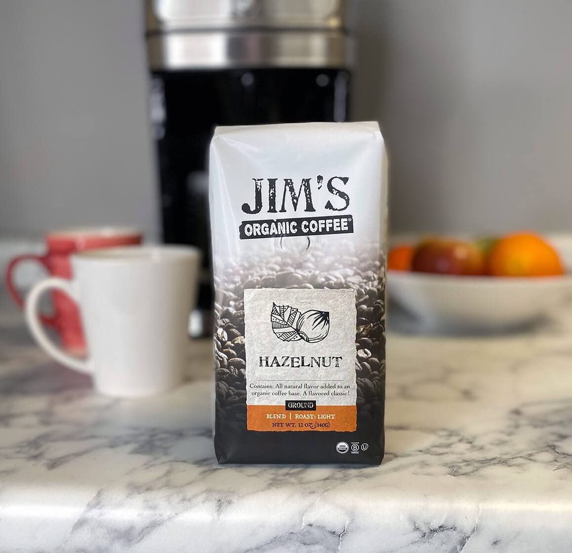 Jim’s Organic Coffee - Hazelnut, All Natural Flavored Blend - Light Roast, Ground Coffee, 12 oz Bag