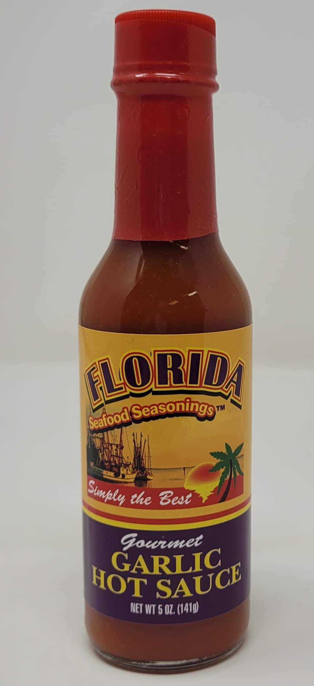 Florida Seafood Seasonings Gourmet Garlic Hot Sauce 5 oz Glass Bottle Simply the best