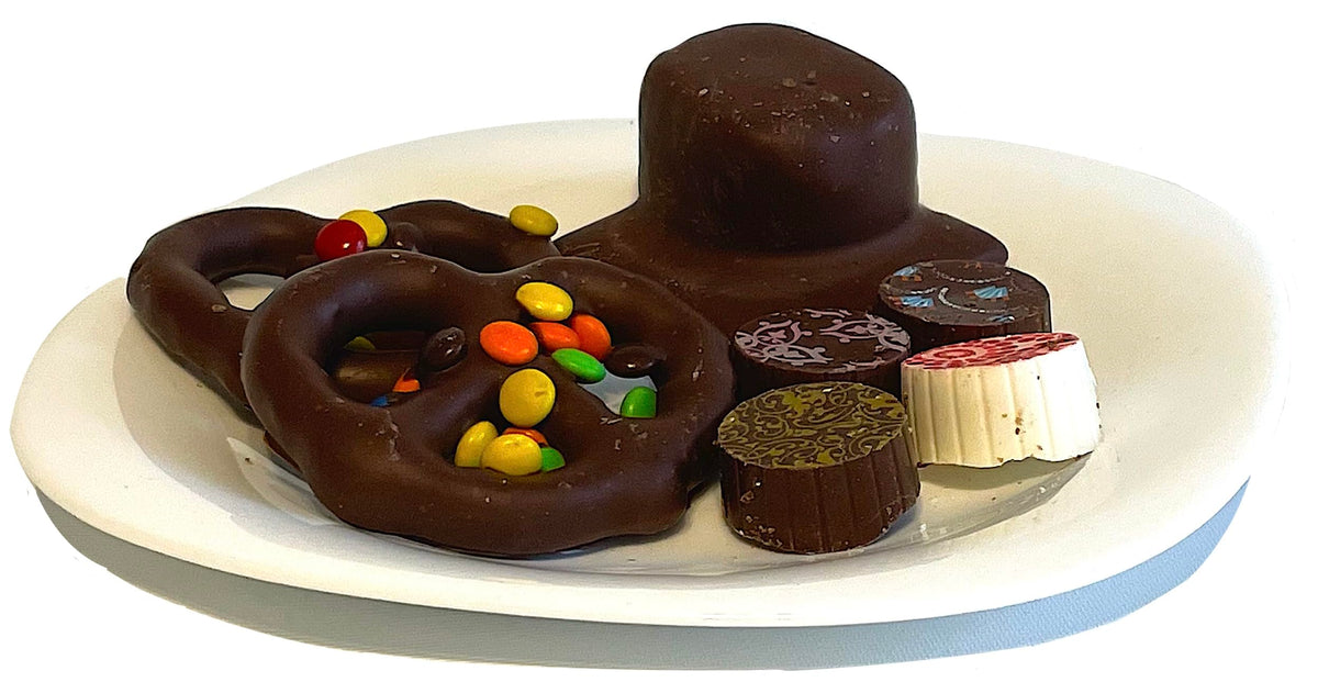 33 Piece Halloween Pumpkin gourmet gift basket of artisan chocolates, cookies, crunches, and snacks. Hand-Crafted and perfect for Halloween parties