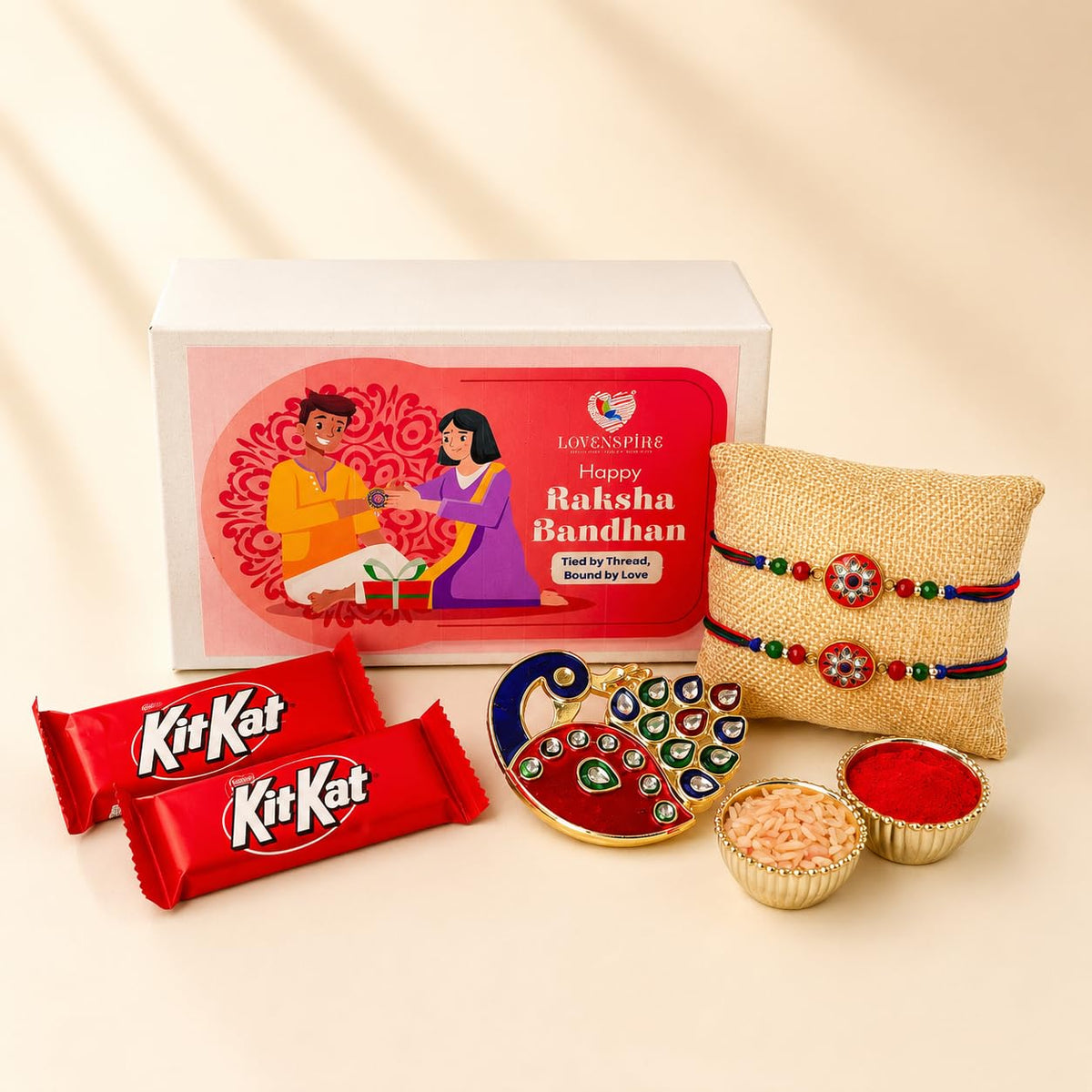 LOVENSPIRE Designer Rakhi Gift Hamper Set for Brother & Bhabhi - Includes 2 Rakhi Bracelet, Haldi Kumkum Holder, Chocolates, Roli Chawal & Gift Box