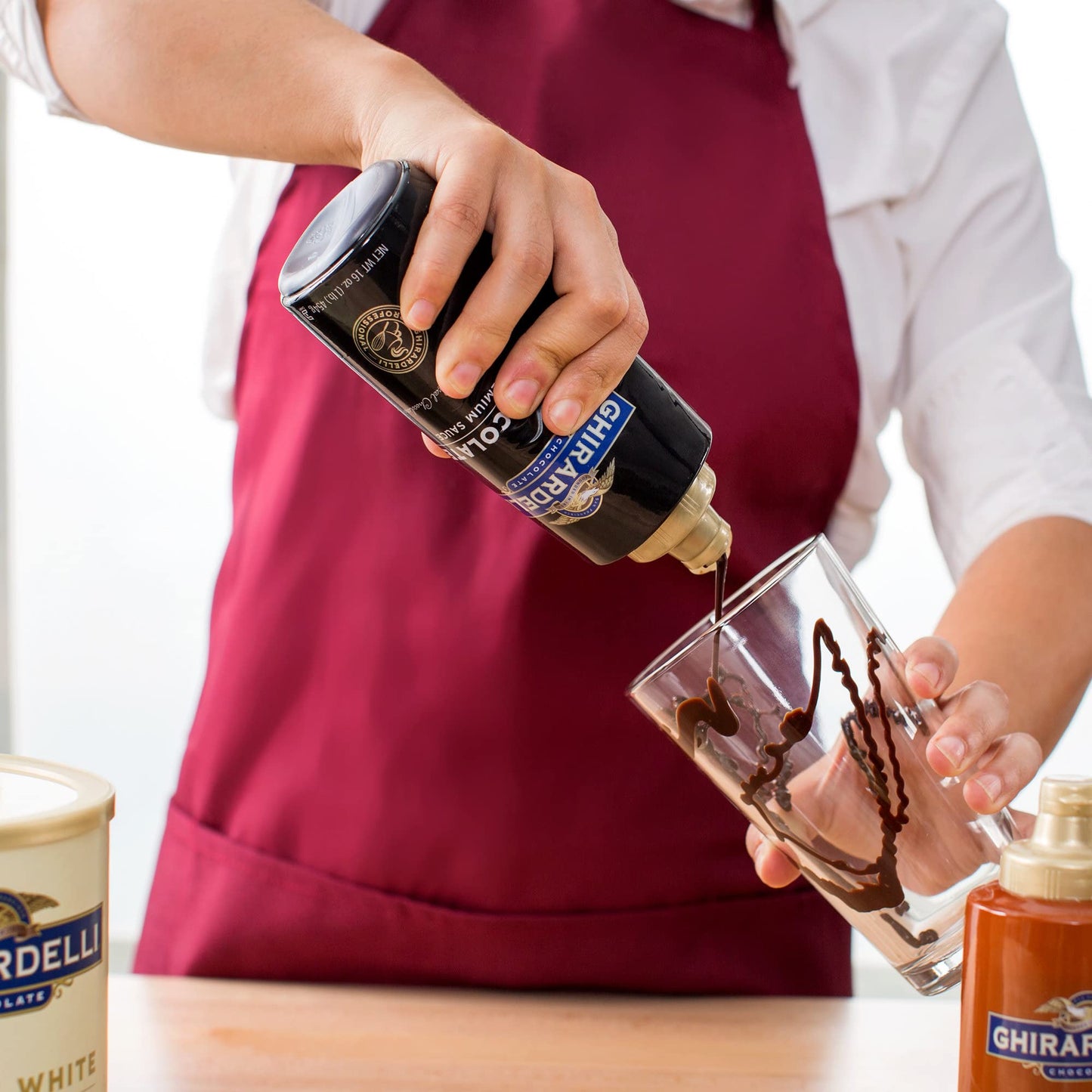Ghirardelli Sea Salt Caramel and Chocolate Flavored Sauce 16 oz Squeeze Bottles (Pack of 2) with Ghirardelli Stamped Barista Spoon