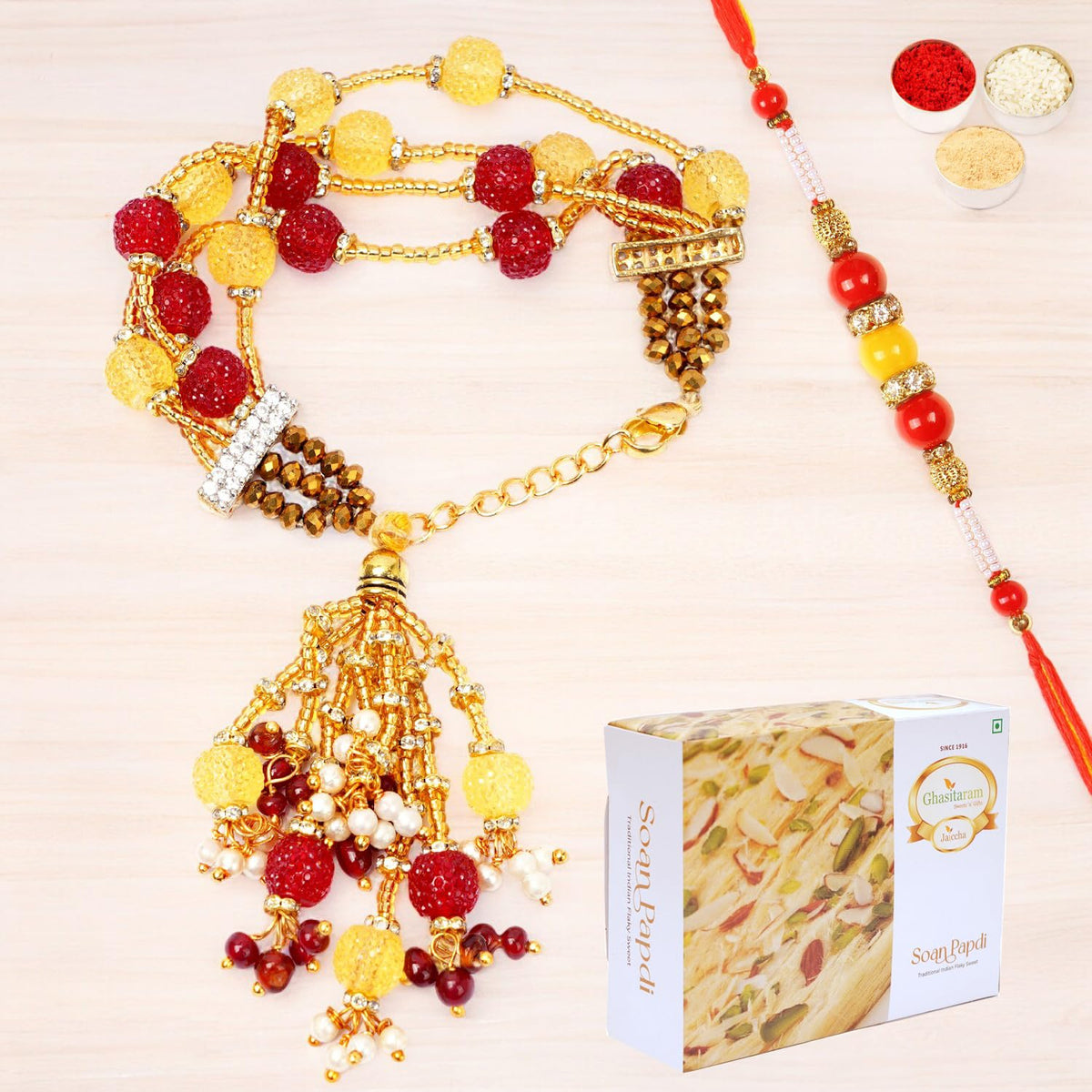 Ghasitaram Gifts Rakhis Online - Rakhi for Brother-RM-205 Bhaiya Bhabhi Rakhi with 200 GMS of Soan Papdi