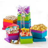 Broadway Basketeers Easter Basket Tower Premade Gift for adults, Kids, Boys, Girls - Includes Gourmet Chocolate, Candy, Easter Eggs a Great Easter