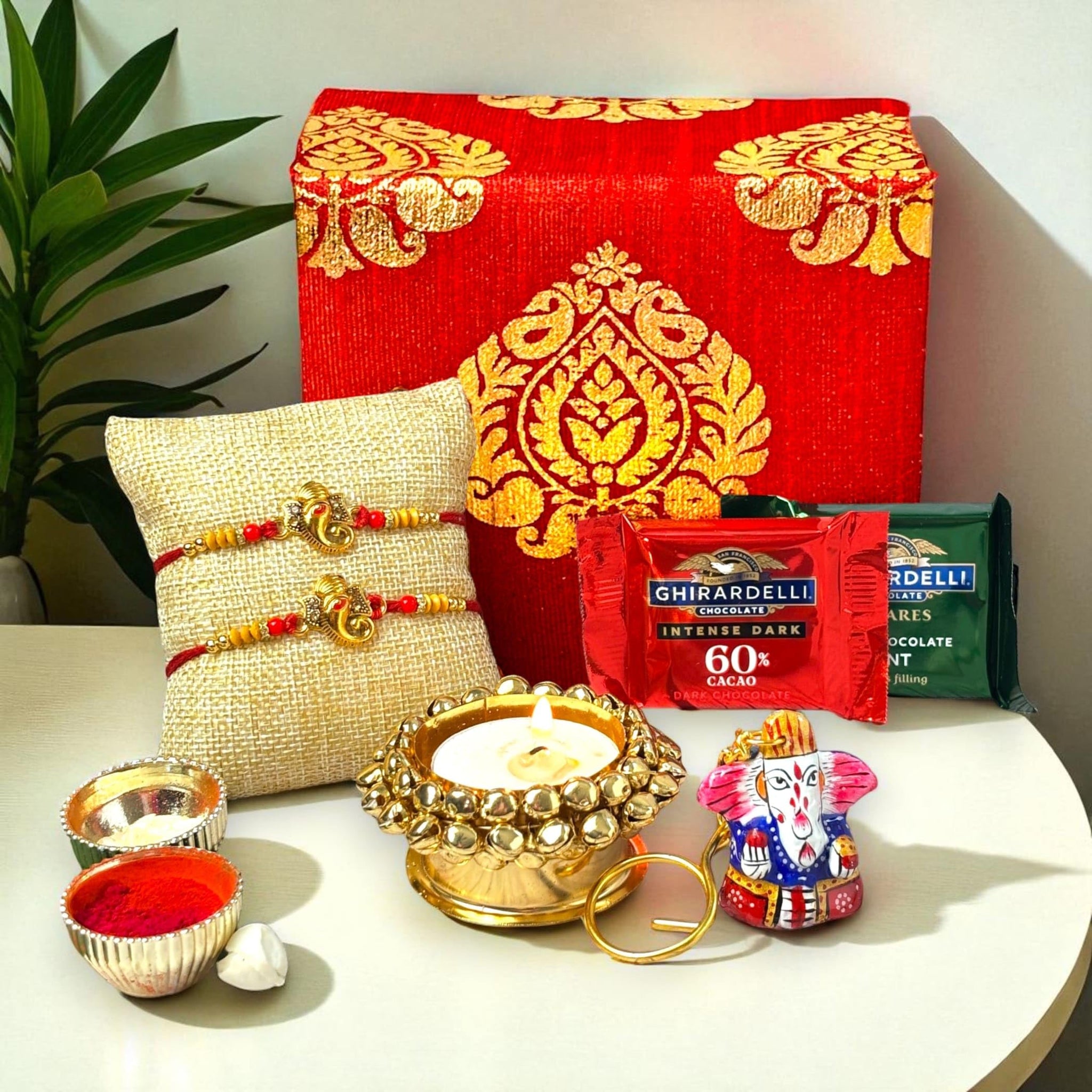LOVENSPIRE Rakhi Gift Hamper for Brother 2PC Ganesha Rakhi with Candle Holder Ceramic Key Chain Roli Chawal Rakshabandhan Card Chocolates with Premium