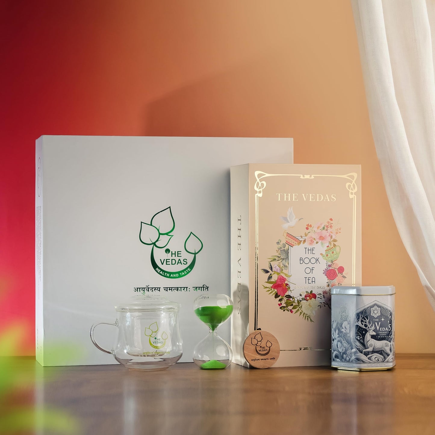 The Vedas Tea Chest| Tea Gift Set | Premium Gift Set containing Glassmug with Infuser and Lid, Premium Black Tea Tin Caddy, Snadclock Timer, Coaster
