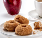 Katz Gluten Free Mini Cinnamon Apple Donuts. Fresh Baked Donuts Made With Apple Chunks and Dusted In Cinnamon Sugar. Grain Free. Tree Nut Free, Peanut