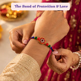 LOVENSPIRE Designer Rakhi Gift Hamper Set for Brother & Bhabhi - Includes 2 Rakhi Bracelet, Haldi Kumkum Holder, Chocolates, Roli Chawal & Gift Box