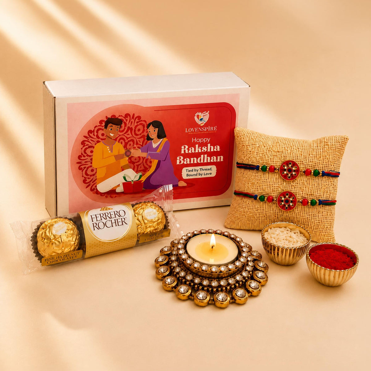 LOVENSPIRE Designer Rakhi Gift Hamper for Brother & Bhabhi - Includes 2 Rakhi Bracelets, Candle Holder, Chocolates, Gift Box & Roli Chawal