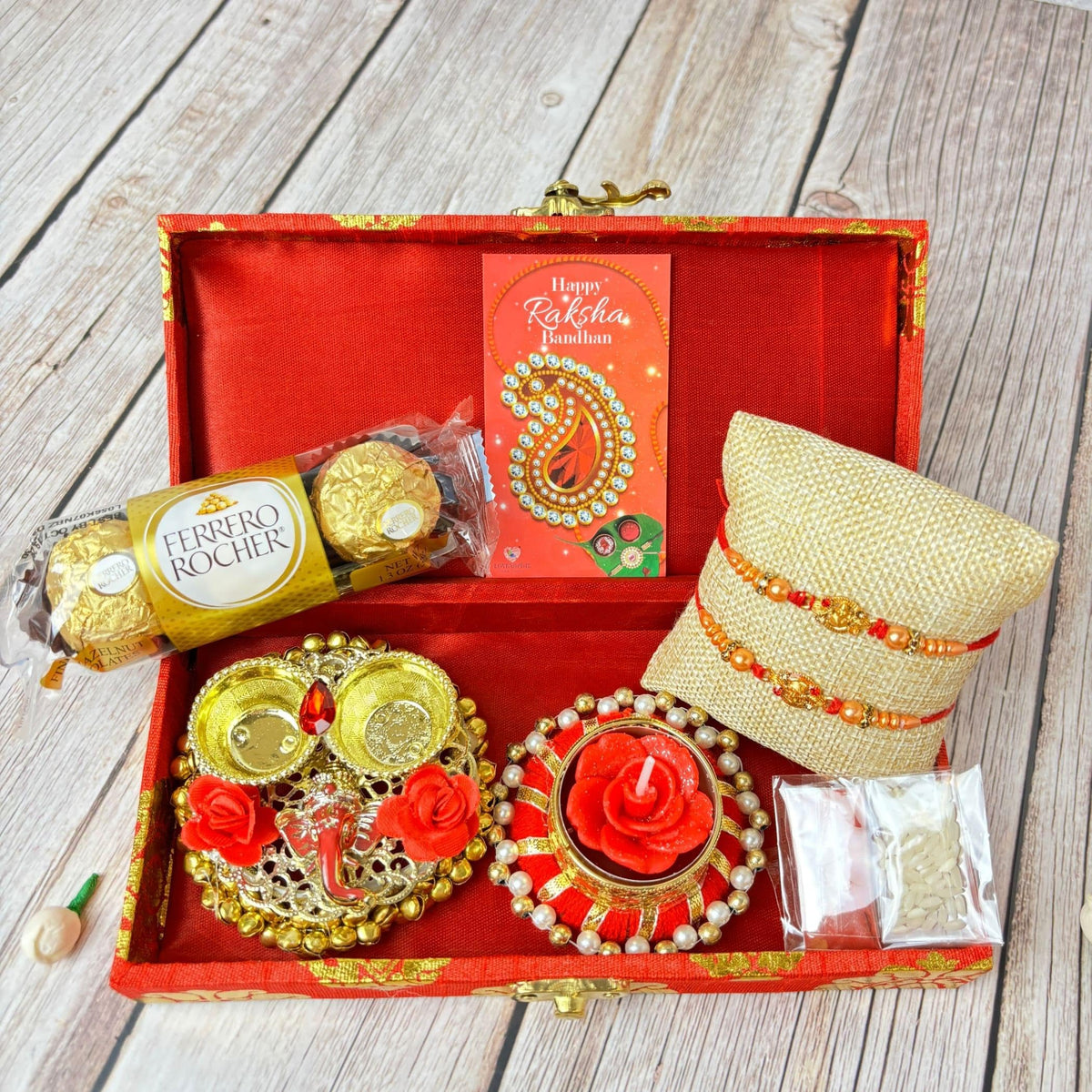 LoveNspire Brocade Raksha Bandhan Gift Hamper for Brother & Bhabhi - Includes 2 Designer Rakhis, Chocolate Pack, Candle Holder, Haldi Kumkum Holder
