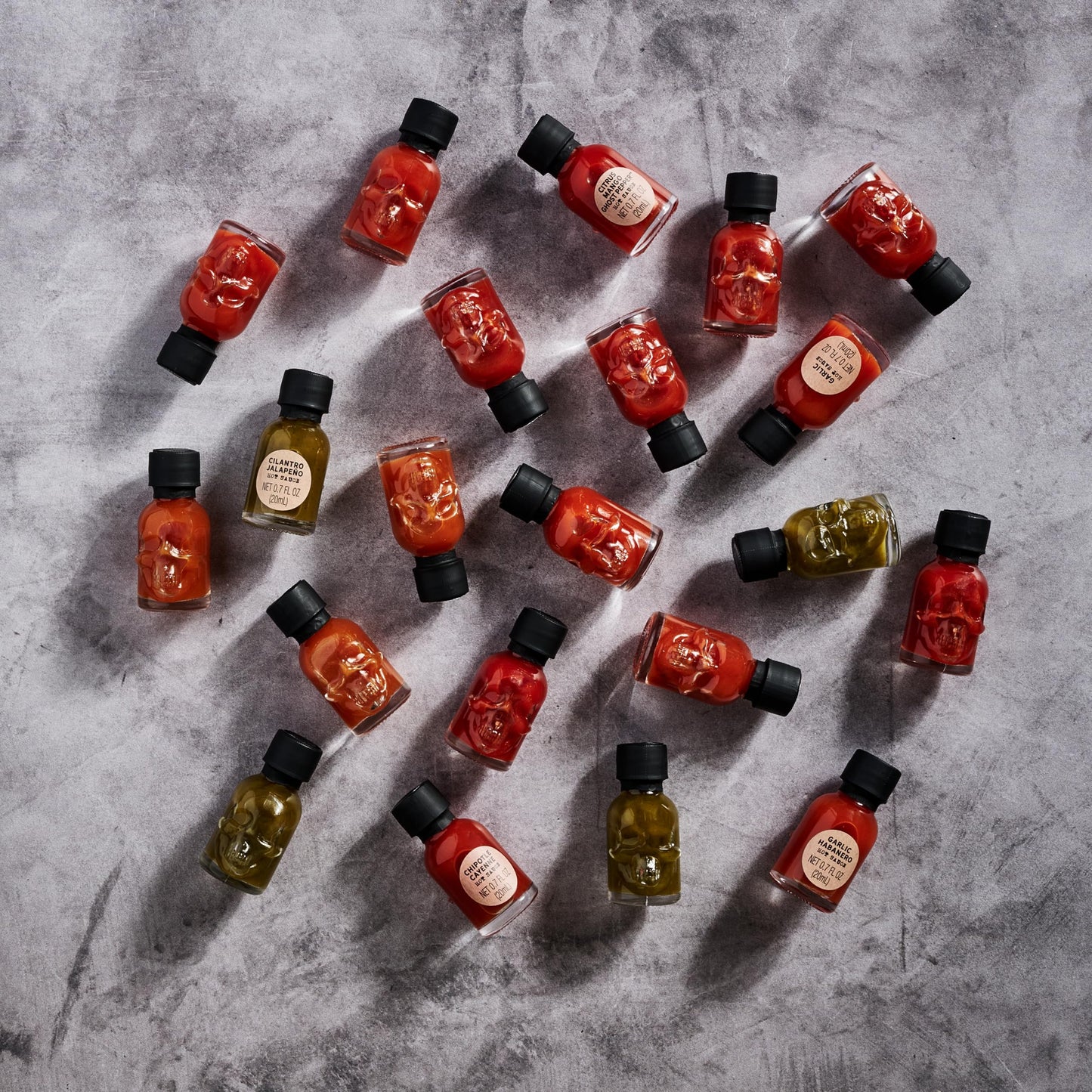 Man Crates, Hot Sauce Inferno Flight, Includes 21 Flavors in Skull-Shaped Mini Hot Sauce Bottles, Spicy Challenge with Habanero, Ghost Pepper & More