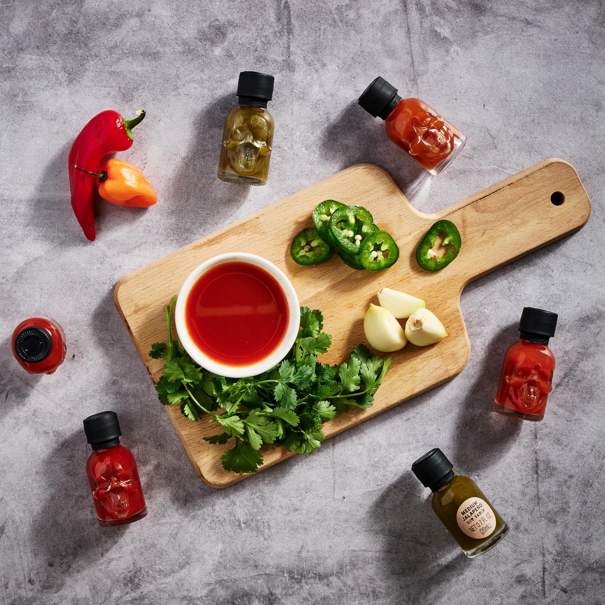 Man Crates, Hot Sauce Inferno Flight, Includes 21 Flavors in Skull-Shaped Mini Hot Sauce Bottles, Spicy Challenge with Habanero, Ghost Pepper & More